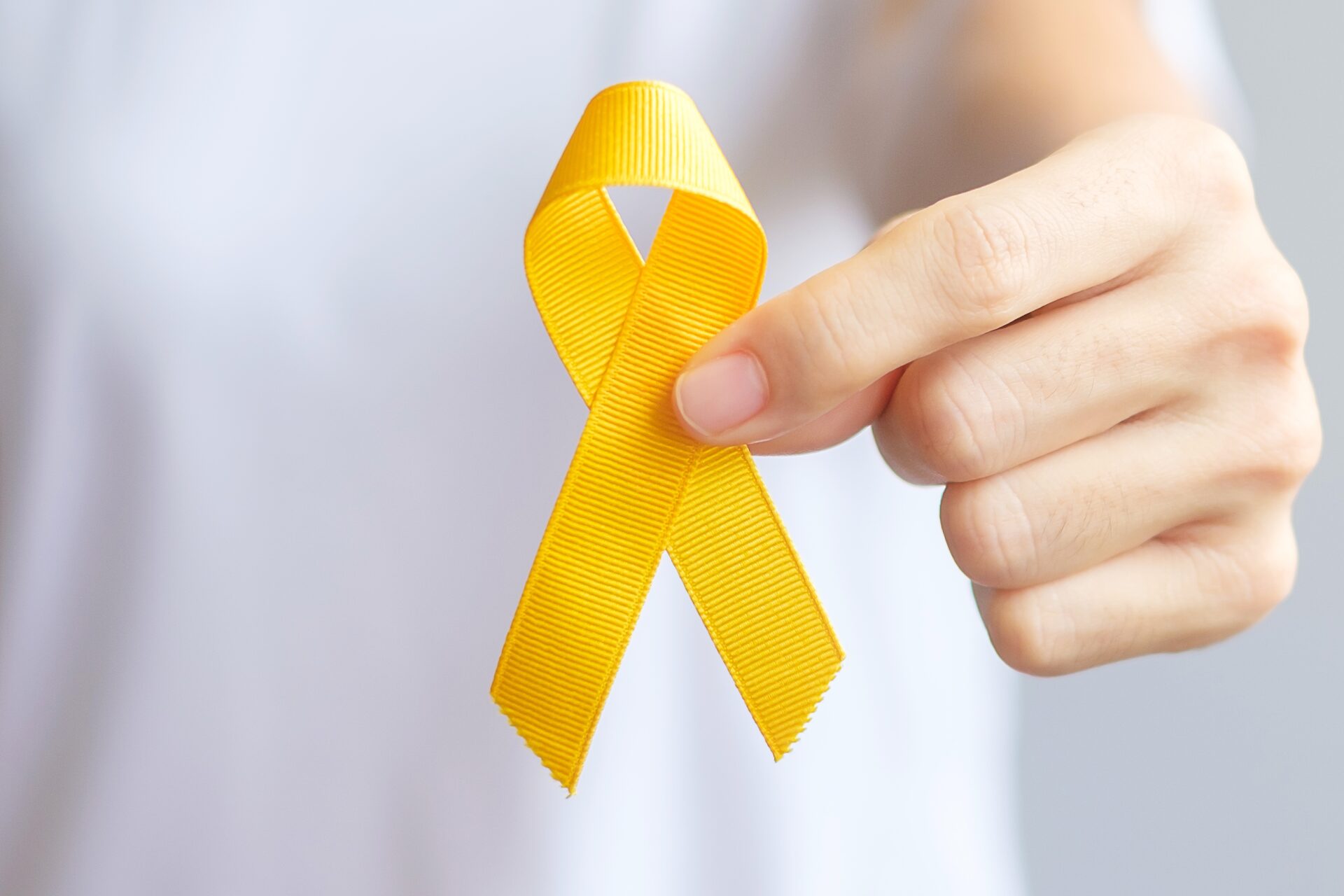 Suicide prevention day, Sarcoma, bone, bladder and Childhood cancer Awareness month, Yellow Ribbon for supporting people living and illness. children Healthcare and World cancer day concept